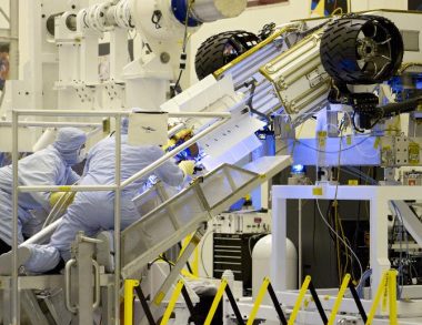 Engineers test-fit Curiosity's nuclear battery, July 2011, (NASA, Cory Huston)